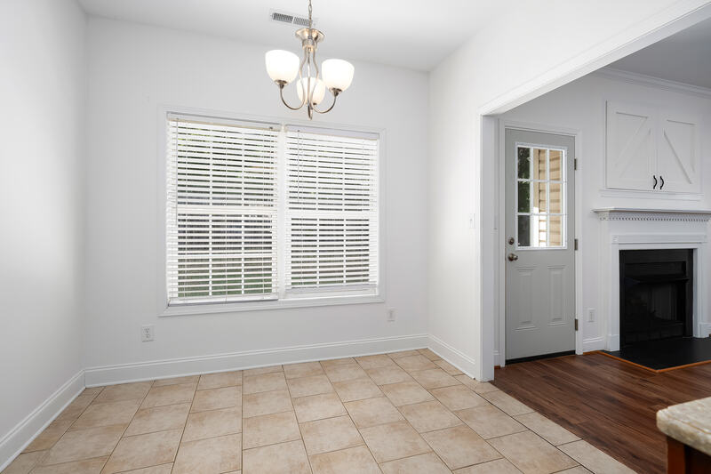 Eating area with large windows and tile floor