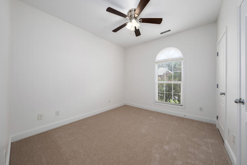 Second bedroom with an arched window