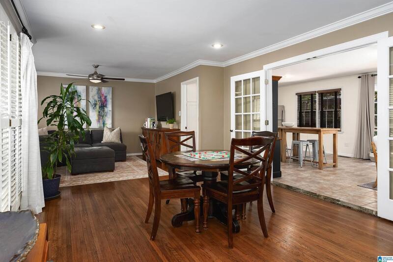 Open living and dining area with hardwood floors