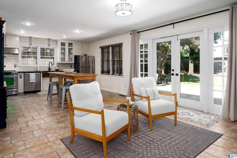 Family room open to the kitchen, with French doors to the patio