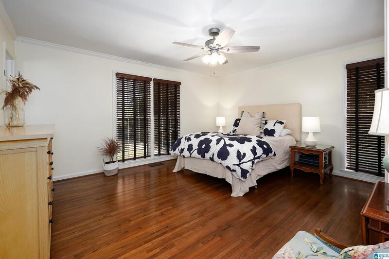 Primary bedroom with hardwood floors