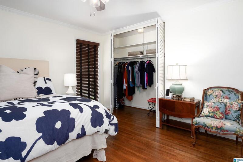 Primary bedroom with a double closet and sitting chair