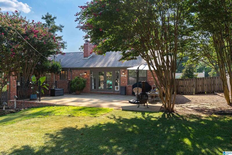 Back of the house with the patio and lawn